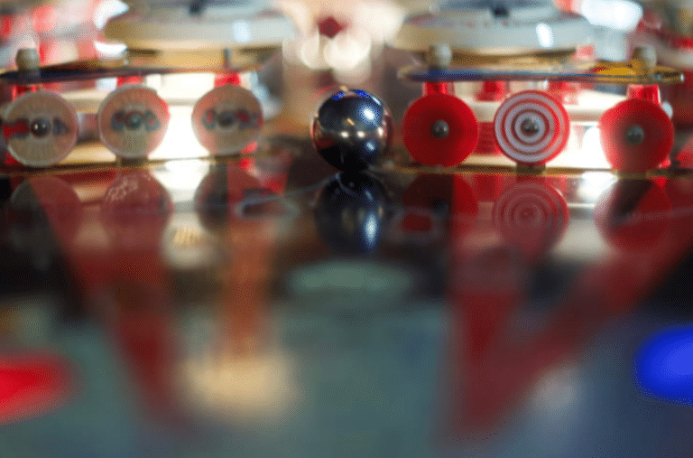 Top 13 Hidden Las Vegas Gems 4 up close photo of a pinball inside a pinball machine, next to the levers.