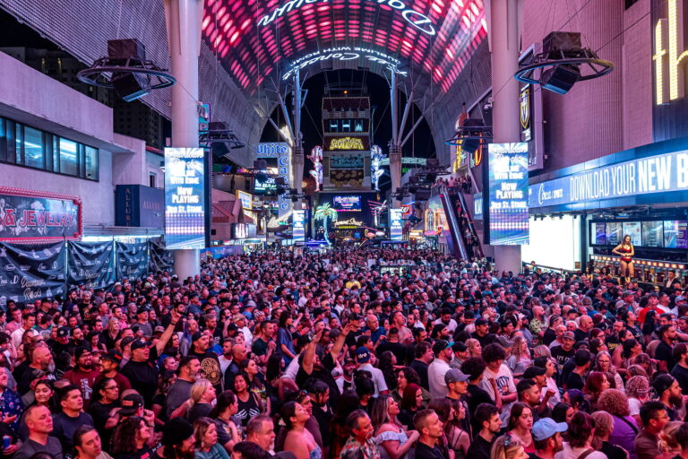 An image of a crowd for a Downtown Rocks concert with the SlotZilla pictured in the background. 