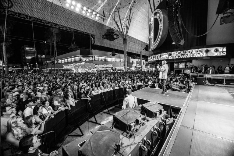 A black and white photo of a Las Vegas concert at Fremont Street Experience.