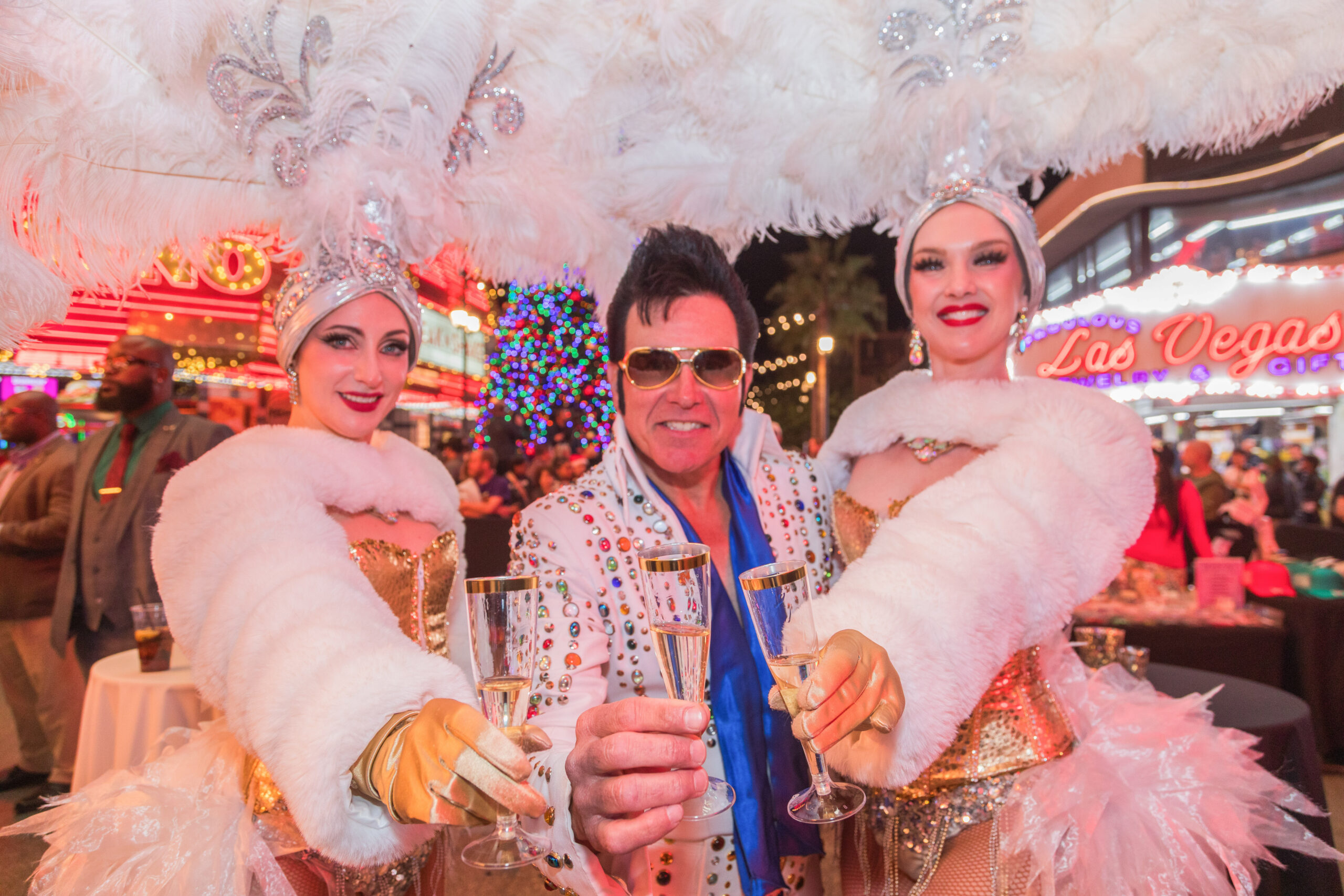 Celebrating on Fremont Street with free Entertainment featuring classic Elvis and real Show Girls